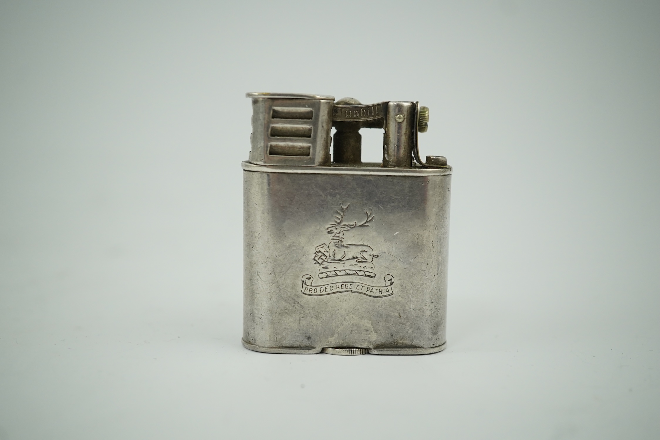 An Edwardian Dunhill cigarette lighter with unmarked crested white metal banding and patent no.288806, height 49mm. Condition - poor to fair